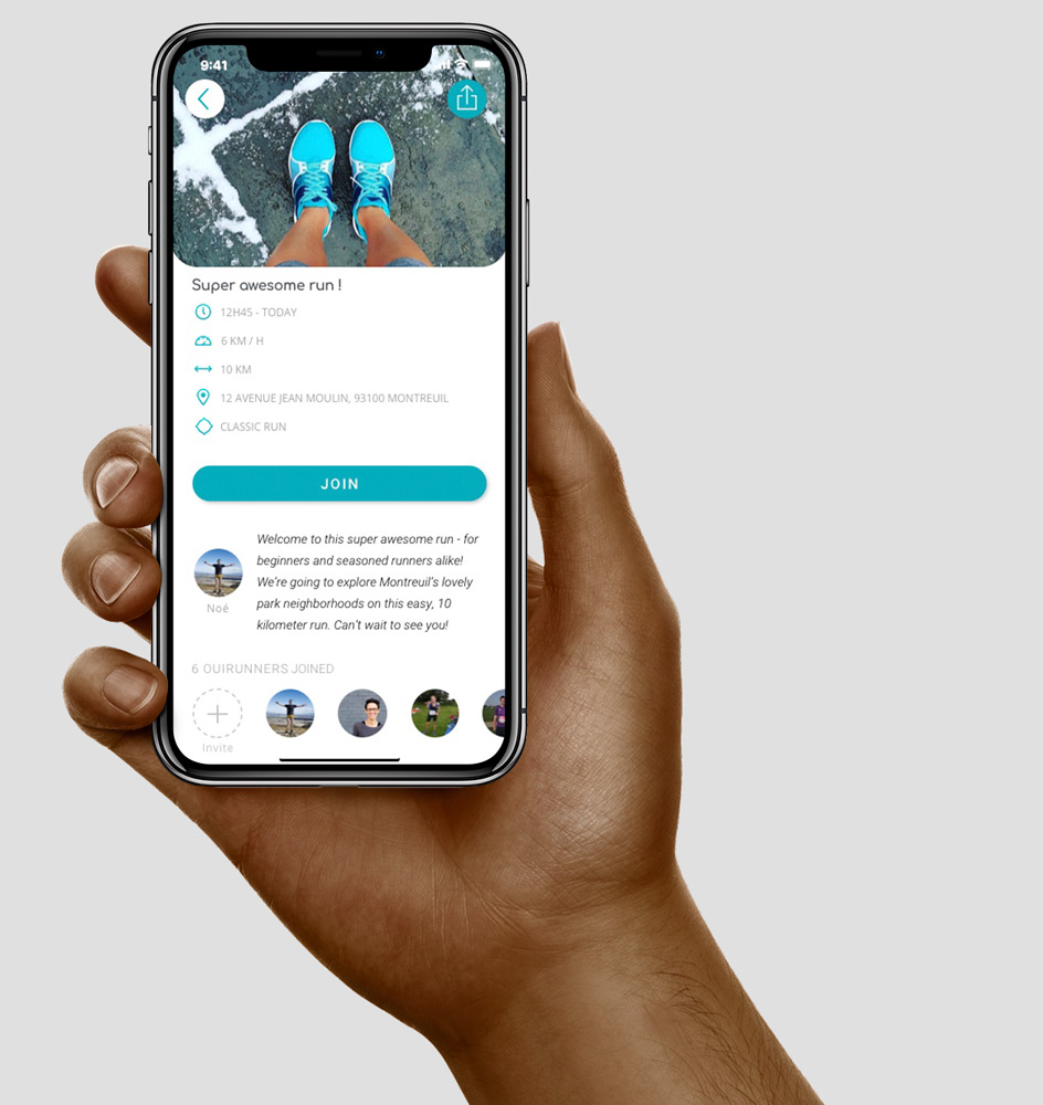 Hand holding phone with OuiRun app